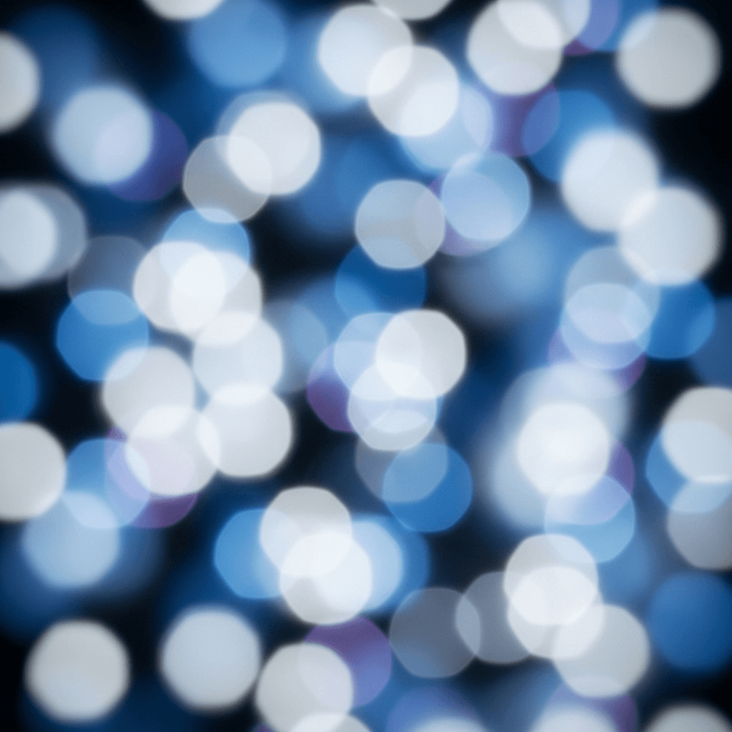 This abstract image features a dense collection of soft-edged, circular bokeh lights in varying shades of cool blue, crisp white, and subtle lavender. The overlapping circles create a sense of depth and luminosity against a deep, dark blue-black background. The texture is smooth and ethereal, suggesting a digital or futuristic atmosphere, perfect for tech-oriented backgrounds or data visualization themes.